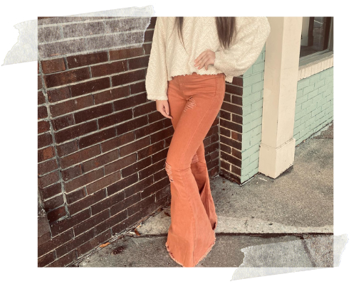 peach-colored bell bottom jeans